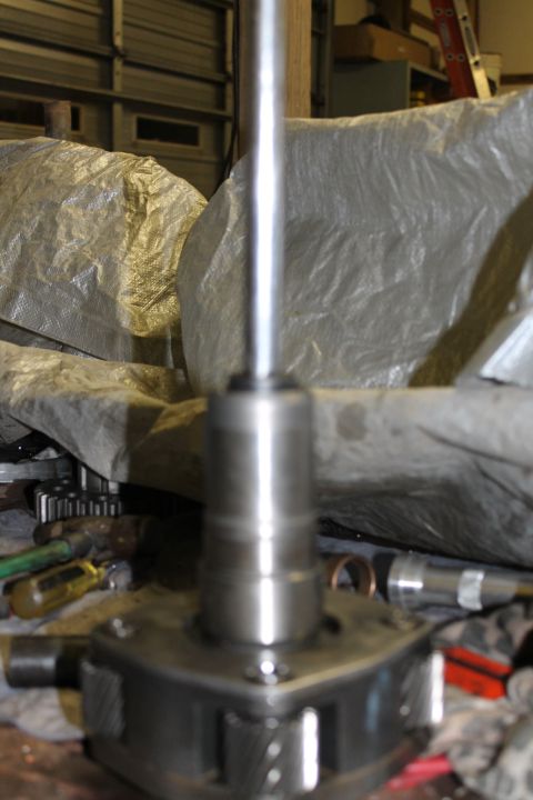 1995 Ford Bronco - Close-up of a metal transfer case component, likely part of a vehicle's drivetrain assembly.
