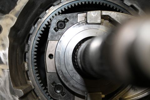 1995 Ford Bronco - Internal view of a vehicle transfer case, showing gears and a shaft.