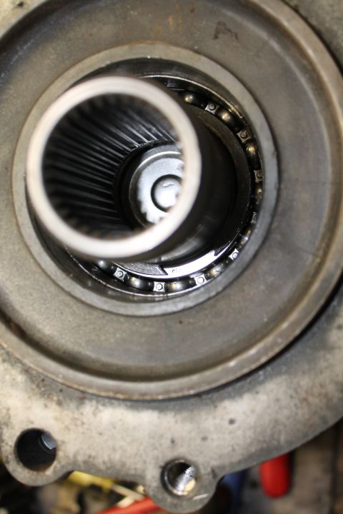 1995 Ford Bronco - Close-up view of a transfer case bearing and internal splines, likely during a rebuild.