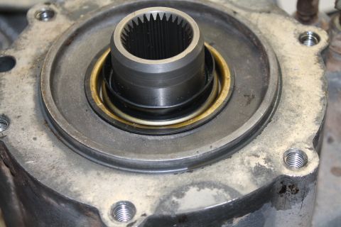1995 Ford Bronco - This image shows a close-up view of a transfer case component, likely a seal and input shaft housing.