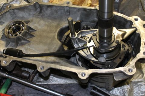 1995 Ford Bronco - Close-up view of the internal components of a vehicle's transfer case, showing gears and shafts.