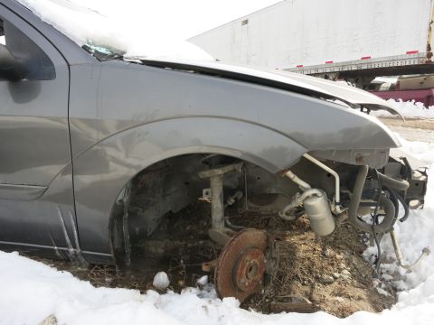 1991 Ford LTD Crown Victoria - This car's front end is heavily damaged and partially disassembled, sitting in snow.
