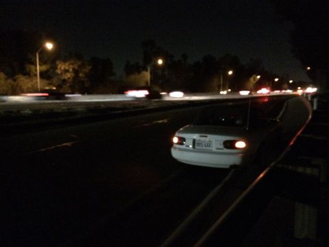 1991 Mazda Miata - Driving a 1991 Mazda Miata at night on a highway.