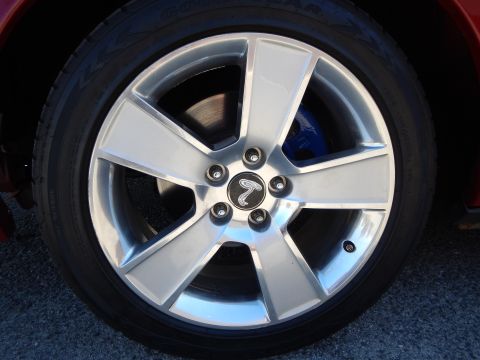 2002 Mercury Grand Marquis - The wheel features a distinctive cobra emblem, suggesting it may not be from a Mercury Grand Marquis.