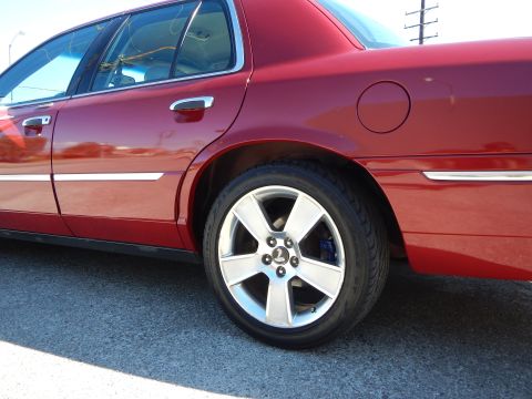 2002 Mercury Grand Marquis - This 2002 Mercury Grand Marquis features a side profile with chrome accents and custom alloy wheels.