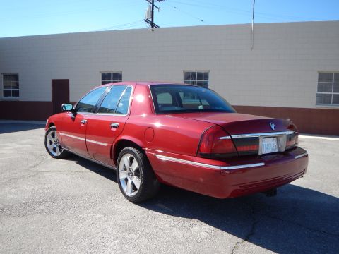 2002 Mercury Grand Marquis - Rear three-quarter view of a red 2002 Mercury Grand Marquis sedan.