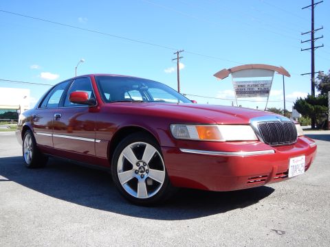 2002 Mercury Grand Marquis - This 2002 Mercury Grand Marquis features a prominent chrome grille and distinctive five-spoke wheels.