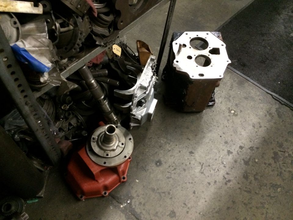 transmission case and shaft components on a workshop floor