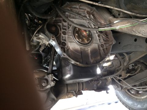 1997 Dodge 3500 - Underside view of a vehicle's transmission bell housing and drivetrain components, likely during a rebuild.