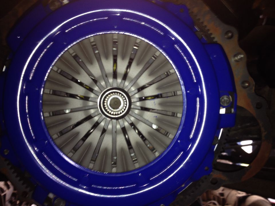 Flywheel, pilot bearing, clutch disc, and pressure plate all installed. That's a Spec pressure plate and Centerforce Dual-Friction disc. I ordered them from promotionpowertrain.com