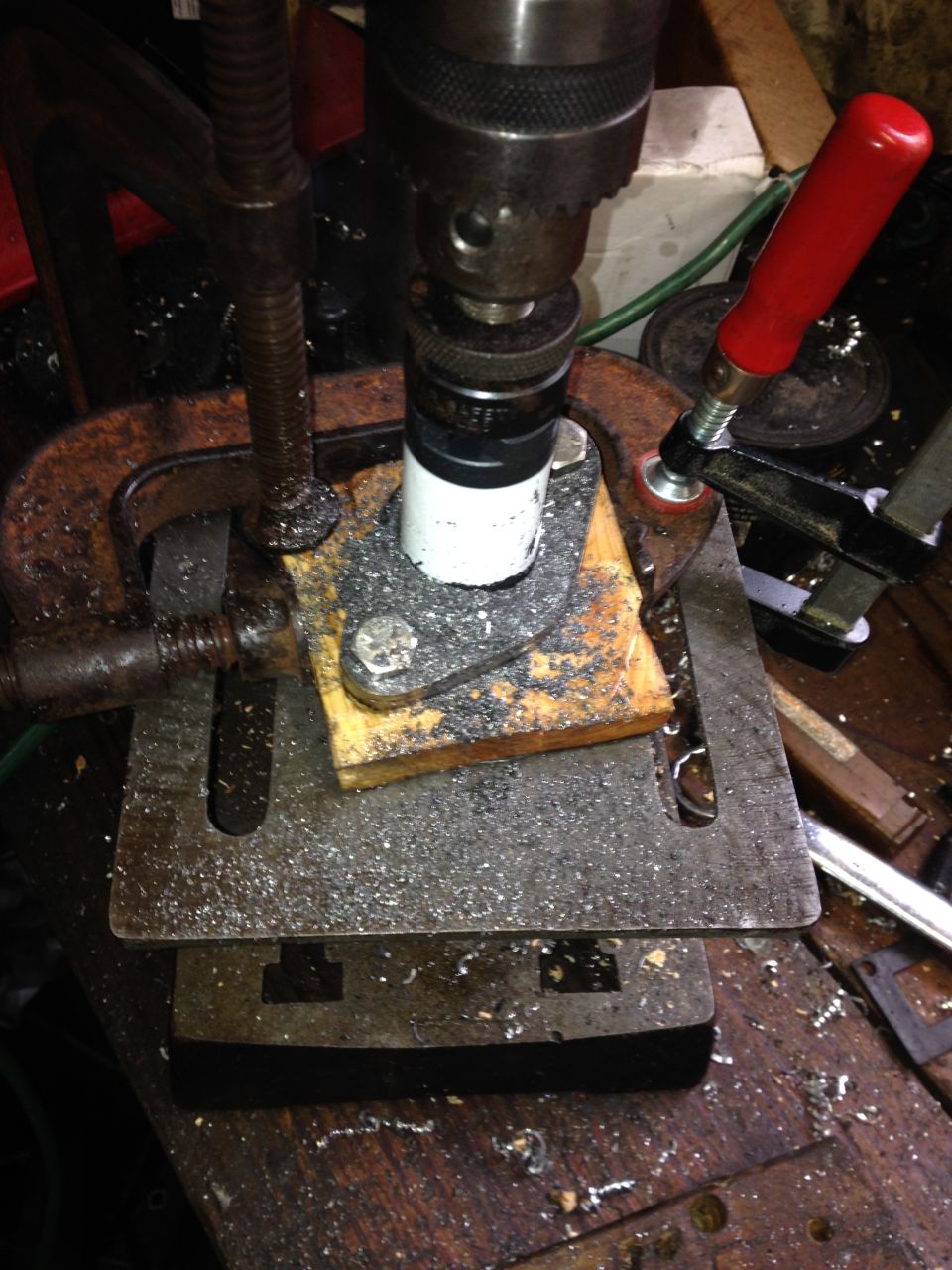 Boring the larger hole. Keeping the saw cutting without too much chatter or sticking was a challenge. It took some serious clamps to keep the plate still.