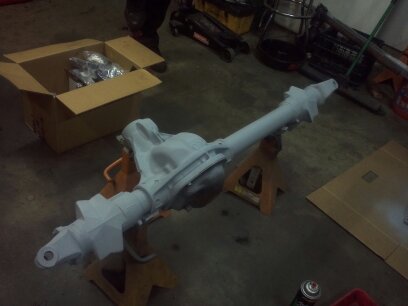 1995 Ford Bronco - A differential axle assembly is shown on jack stands, likely awaiting installation or refurbishment.