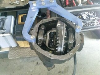 1995 Ford Bronco - Differential assembly from a Ford Bronco, being worked on with a specialized tool.