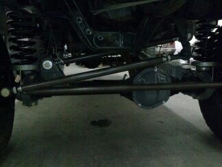 1995 Ford Bronco - This image shows the undercarriage of a vehicle, focusing on its suspension system with prominent springs and shocks.