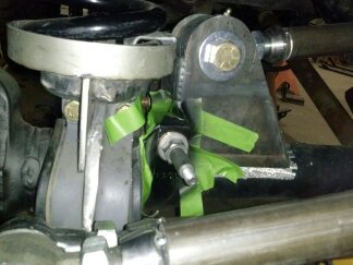 1995 Ford Bronco - Close-up view of a custom suspension bracket modification on a vehicle's rear axle.