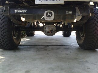 1995 Ford Bronco - Underside view of a truck's rear axle and suspension components, showing a Draw-Tite hitch.