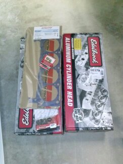 1995 Ford Bronco - Boxes of Edelbrock performance engine parts, including cylinder heads and a gasket set, are displayed.