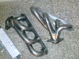 1995 Ford Bronco - Pair of exhaust headers, likely for a vehicle engine build.