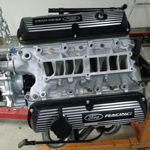 1995 Ford Bronco - A Ford Racing engine is shown, likely undergoing a build or repair.