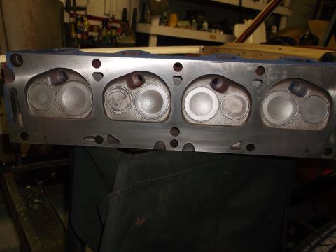 1967 Ford Mustang - A close-up view of an engine's cylinder head, showing the intake and exhaust valves.