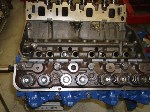 1967 Ford Mustang - Close-up view of an engine block and cylinder head assembly with visible valves and springs.