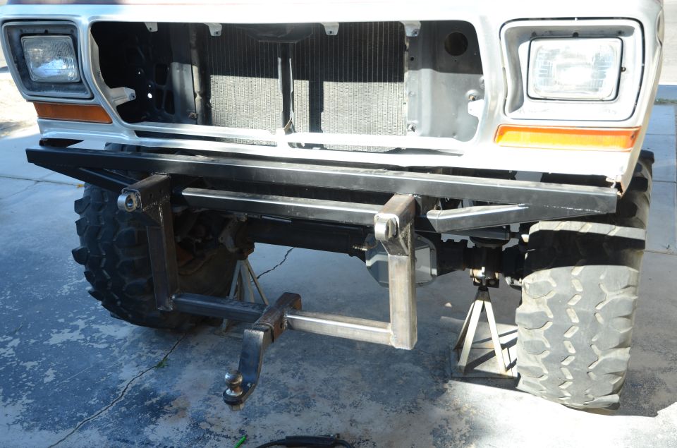 1979 Ford Bronco front end with custom rear bumper and hitch installed, vehicle on jack stands