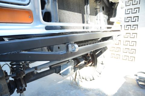 1979 Ford Bronco - Front view of a 1979 Ford Bronco, highlighting the custom bumper, tow hook, and suspension system.
