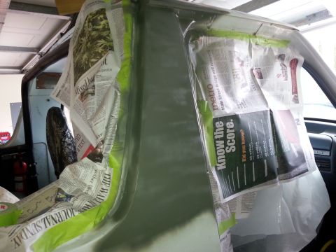 1992 Ford Bronco - Newspaper and masking paper protect the interior of a vehicle undergoing body work and rust repair.