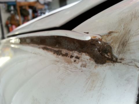 1992 Ford Bronco - Rust damage is visible along the drip rail of a vehicle, indicating repair needs.