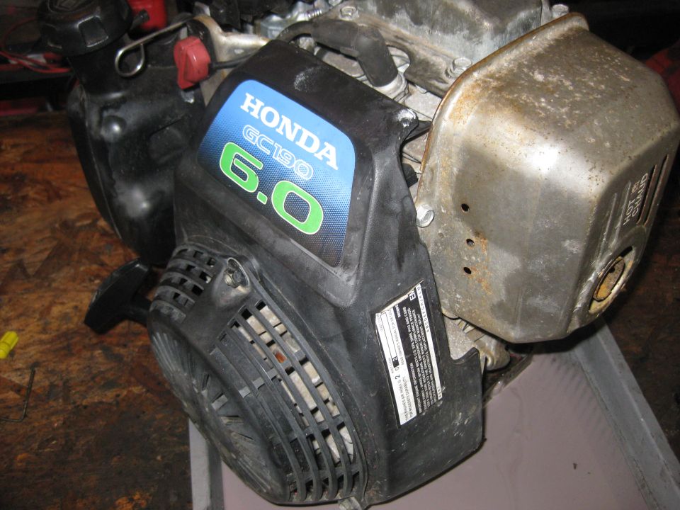 Honda GC190 engine with 6.0 HP rating and a metal exhaust cover
