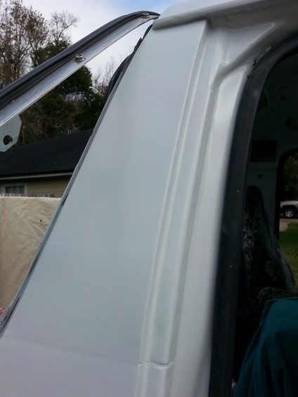 1992 Ford Bronco - Close-up of the drip rail area on a white 1992 Ford Bronco, showing recent body work.