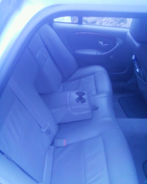 1999 Ford Fairlane - The interior of a car is visible, focusing on the rear seating area.
