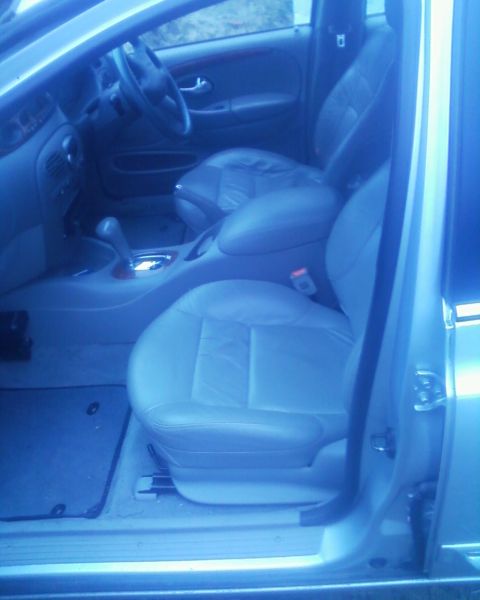 1999 Ford Fairlane - Interior view of a car, focusing on the seats and dashboard area.