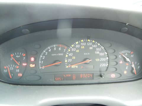 1999 Ford Fairlane - The dashboard displays the speedometer, tachometer, fuel gauge, and temperature gauge, along with an odometer reading of 83204.