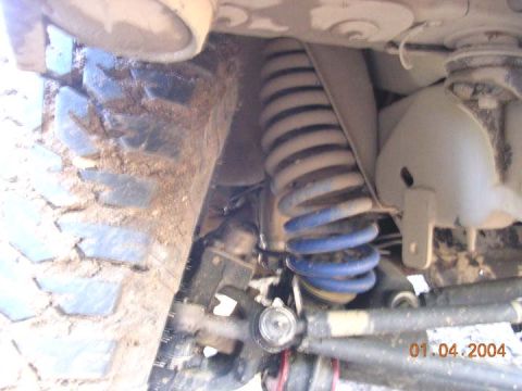 1994 Ford Bronco - need to reowrk the lower coil mounts I made. Compression forced the srping into an odd shape huh?