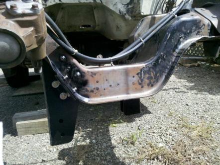 1982 Ford Bronco - Close-up of a vehicle's frame and steering assembly, showing rust and wear.