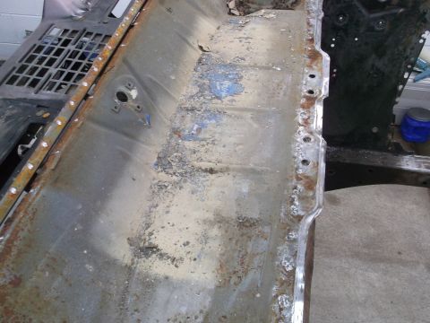 1967 Ford Mustang - This image shows the interior of a vehicle's floor pan, which appears to be undergoing restoration or repair.