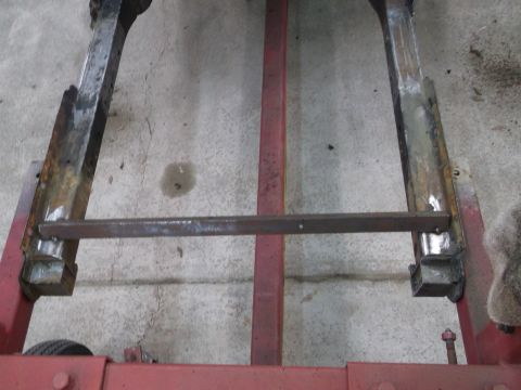 1967 Ford Mustang - Rusted metal frame components are shown on a stand, possibly for repair or restoration.