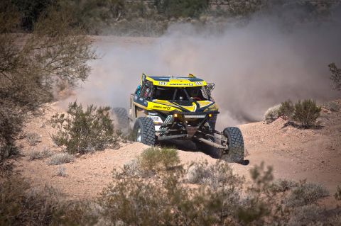 1996 Ford Bronco - A custom-built off-road buggy navigates a dusty desert course during a race.