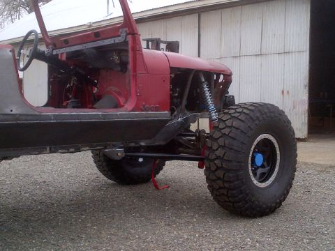 1985 Jeep CJ7 - Customized 1985 Jeep CJ7 showing off its modified suspension and off-road tires.