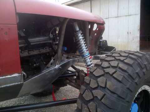 1985 Jeep CJ7 - Custom off-road vehicle modification with exposed engine and heavy-duty suspension components.