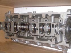 2004 Ford Crown Victoria - Close-up view of an engine cylinder head, showing internal components and a timing gear.
