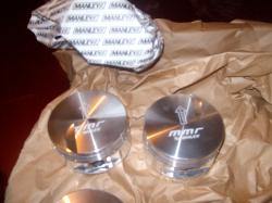 2004 Ford Crown Victoria - Two new MMR pistons are shown, likely for an engine modification project.