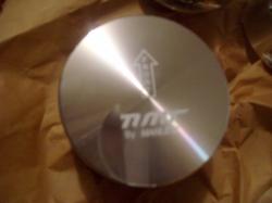 2004 Ford Crown Victoria - A close-up of a TMI by Speed-Pro engine piston, likely a performance part.