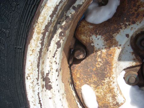 1963 Hummer H3 - A heavily rusted wheel hub and a deteriorated tire are visible in this close-up shot.