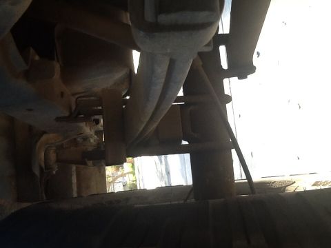 1991 Ford Bronco - This photo shows the undercarriage of a vehicle, focusing on suspension and exhaust parts.