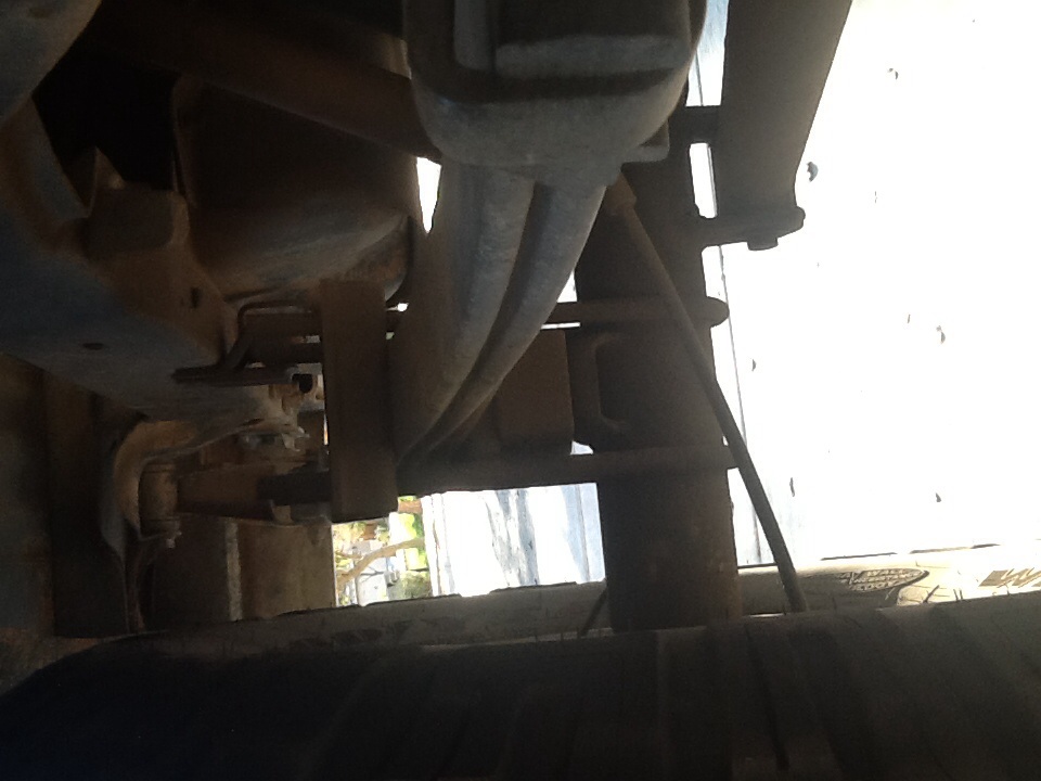 Underside view of vehicle suspension and exhaust components