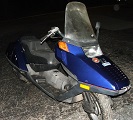 2006 Honda Reflex - A blue scooter is parked outdoors at night, showing its front view with a large windshield.