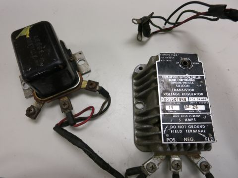2001 Ford Crown Victoria - Two electrical components, a voltage regulator and a black box, are shown against a white background.