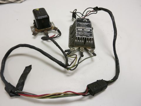 2001 Ford Crown Victoria - Electrical components including a voltage regulator and relay with a wiring harness.
